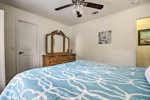 a bedroom with a bed and a ceiling fan at Comfortable Pensacola Home with Private Pool! in Perdido Key