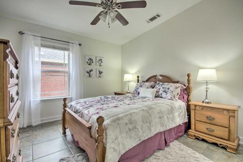 a bedroom with a bed and a ceiling fan at Comfortable Pensacola Home with Private Pool! in Perdido Key