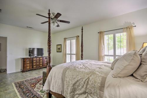 a bedroom with a bed and a ceiling fan at Comfortable Pensacola Home with Private Pool! in Perdido Key