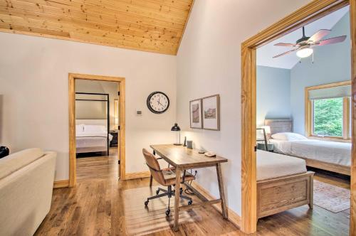 a bedroom with a desk and a bed and a mirror at Luxe Wintergreen Resort Escape with Hot Tub! in Roseland