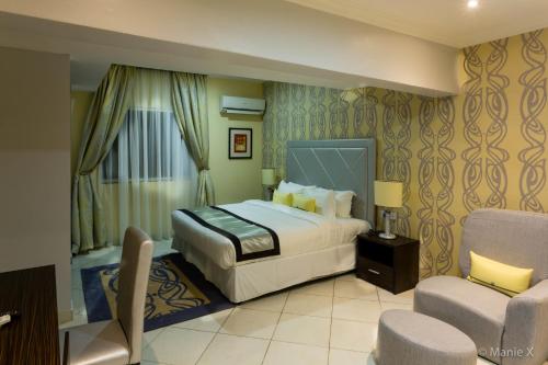 En eller flere senge i et værelse på Morning Side Suites & Spa