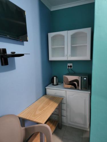 Η κουζίνα ή μικρή κουζίνα στο Hasate Guest House ,4 st james street Oakdale Belliville Cape Town South Africa