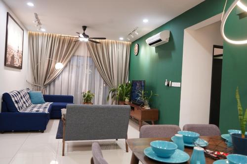 a living room with a blue and green wall at Aldridge Residence Executive Suite 2B@Shah Alam in Shah Alam