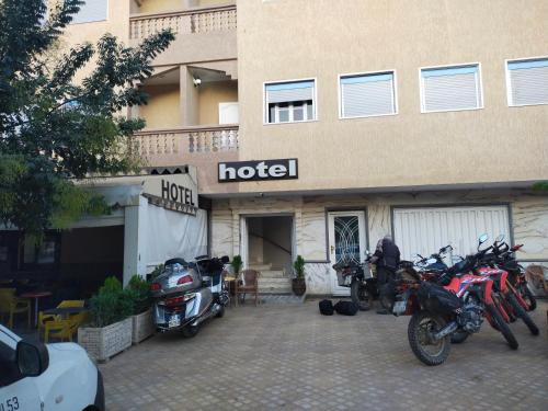 a group of motorcycles parked outside of a hotel at Hôtel Imilchil in Midelt