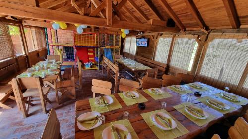 an overhead view of a dining room with tables and chairs at Carev konak in Ždrelo
