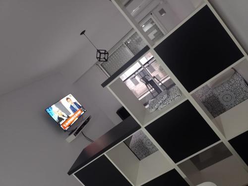 an overhead view of a living room with black and white tiles at Alquiler Temporario Rosario 4 in Rosario