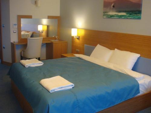Кровать или кровати в номере Golden Palas Hotel
