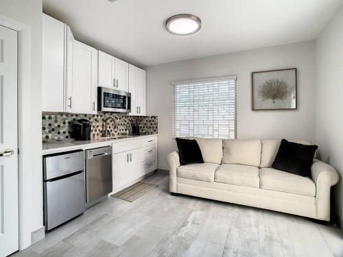 a living room with a couch in a kitchen at Steps From the beach, renovated 1bd 1 bth in Clearwater Beach