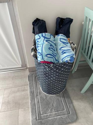 a basket with pillows sitting on a floor next to a door at Steps From the beach, renovated 1bd 1 bth in Clearwater Beach