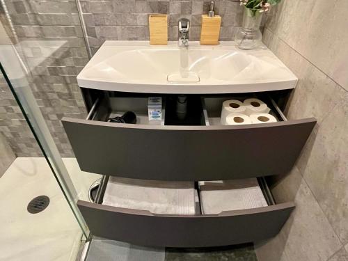 a bathroom with a sink and a shower at Prime Loft ANDORRA HUT2-06207 in Pas de la Casa