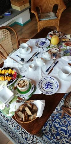 a table with plates of food on top of it at La Giribaldina Winery & Farmhouse in Calamandrana