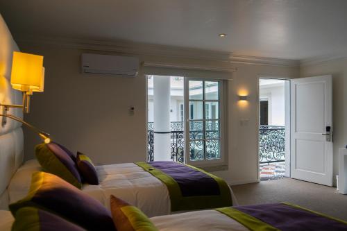 Кровать или кровати в номере Casa Hidalgo Hotel Boutique