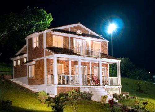 a house with a light on top of it at San Agustin Internacional Hotel in San Agustín