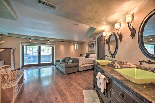 a bathroom with a sink and a bed in a room at Homey Mtn View Escape 11 Mi to Garden of the Gods in Cascade-Chipita Park