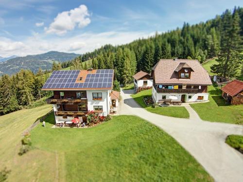 an aerial view of a house with a solar roof at Biohof Stockreiter vulgo Grillschmied in Murau