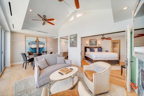 a bedroom with a bed and a living room at Beach House Steps from Balboa Ferry in Newport Beach
