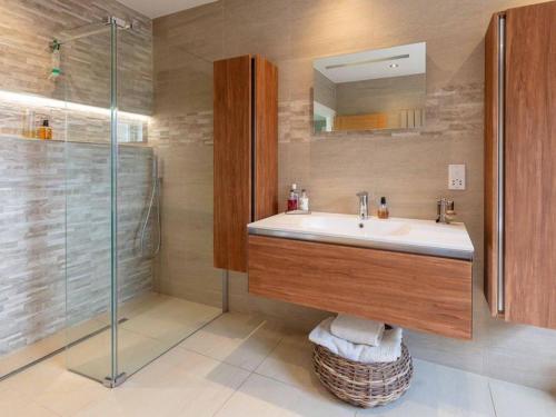 a bathroom with a sink and a shower at The Cottage At Briarlea in Larkhall