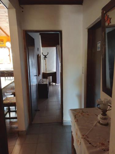 a hallway leading to a living room with a table at Casa Confortable in Mar del Plata