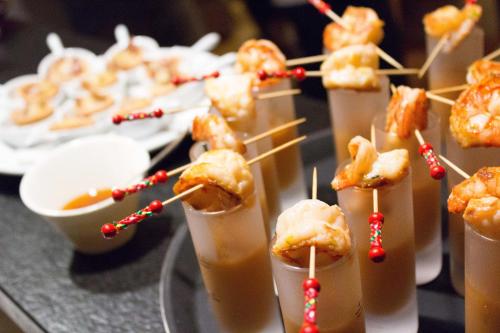 a bunch of food on a table with drinks at Crans Luxury Lodges in Crans-Montana