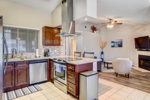 a kitchen with a sink and a stove top oven at 7 Mi to Dtwn Chandler Pet-Friendly Condo with Pool in Chandler