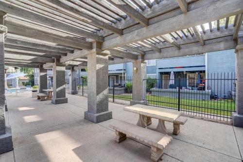 a pavilion with two benches and a fence at 7 Mi to Dtwn Chandler Pet-Friendly Condo with Pool in Chandler
