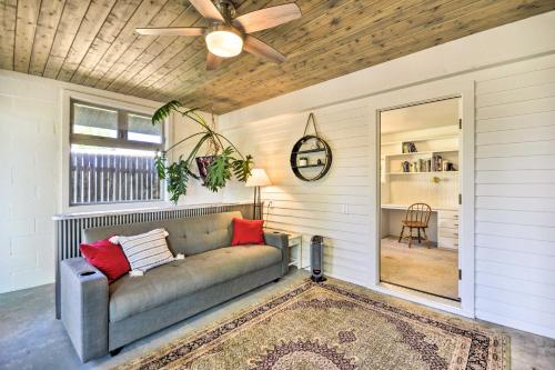 a living room with a couch and a ceiling fan at Beautiful Cody Abode with Grill - Walk to Downtown! in Cody