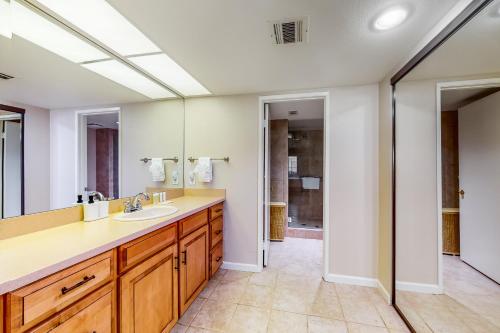 a bathroom with a sink and a mirror at Spring into Oasis Permit# 5140 in Palm Springs