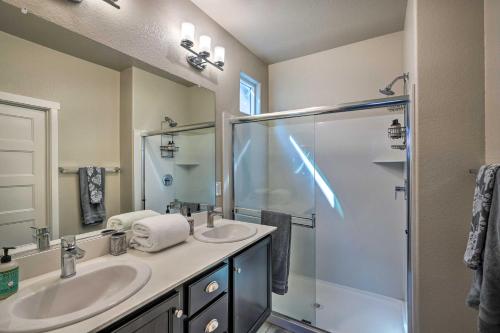 a bathroom with two sinks and a shower at Pet-Friendly Elk Grove Retreat with Balcony! in Elk Grove
