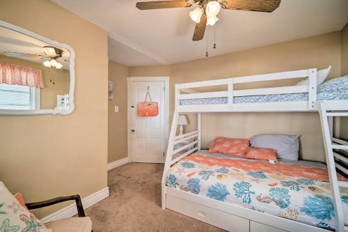 a bedroom with two bunk beds and a ceiling fan at Nautical Wildwood Apt - Walk to the Beach! in Wildwood