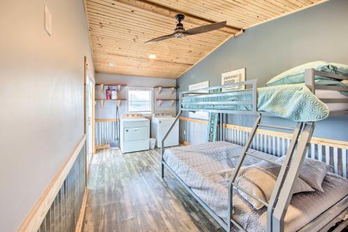 a bunk room with two bunk beds and wooden ceilings at Gun Barrel City Lake House with Boat Launch and Grill! in Gun Barrel City
