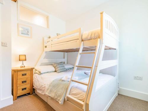 a bedroom with a bunk bed with a ladder at Claro Cottage - Uk37450 in Pateley Bridge
