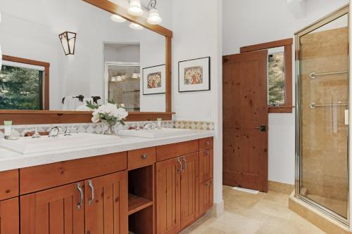 a bathroom with two sinks and a shower at 358 Cresta Road in Edwards