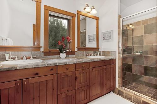a bathroom with two sinks and a shower at 358 Cresta Road in Edwards