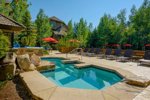 a swimming pool in a yard with chairs and a house at 358 Cresta Road in Edwards