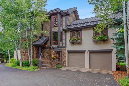 a house with two garage doors on a driveway at 358 Cresta Road in Edwards