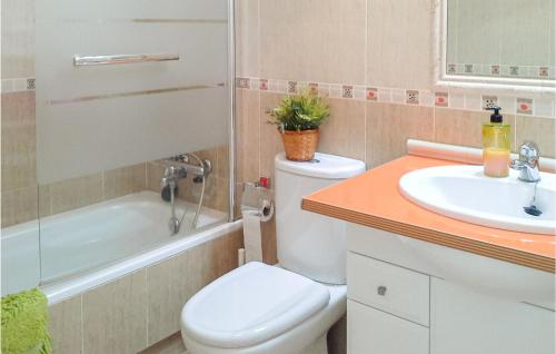 a bathroom with a toilet and a sink at 2 Bedroom Cozy Apartment In La Puebla in La Puebla