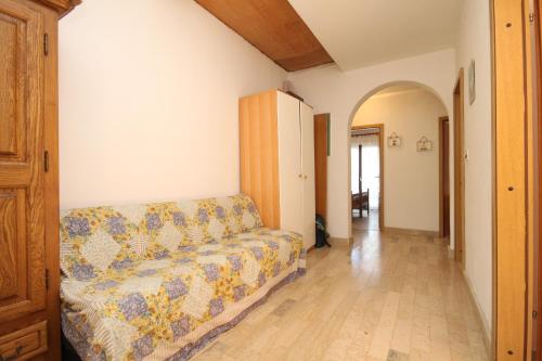a living room with a couch and a hallway at Apartments by the sea Cove Merascica, Cres - 8071 in Štivan