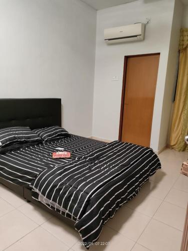 Postel nebo postele na pokoji v ubytování Rumah singgah Haida