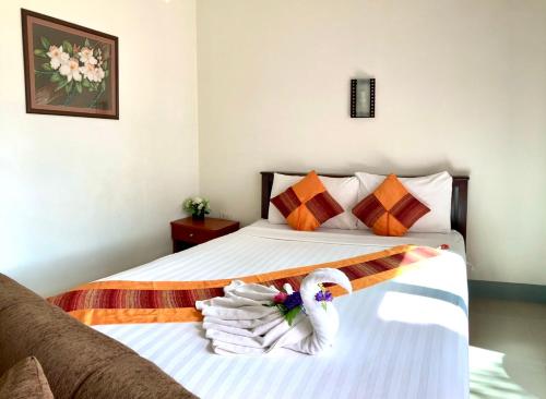 Postel nebo postele na pokoji v ubytování Lanta Just Come Hotel