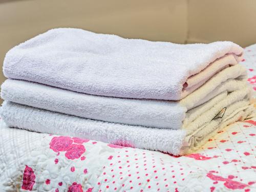a stack of towels sitting on top of a bed at Annex 2 - Uk35340 in Ranskill