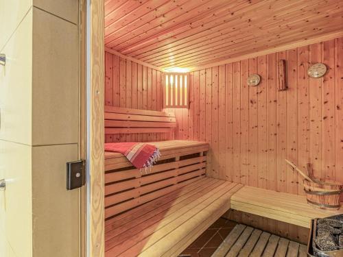 a wooden sauna with a bed in it at The Bath House in Cromer