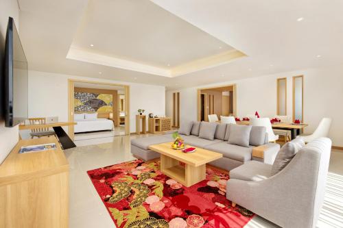 a living room with a couch and a table at Da Nang - Mikazuki Japanese Resorts & Spa in Da Nang