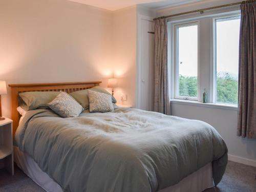 מיטה או מיטות בחדר ב-Puddingstone Cottage