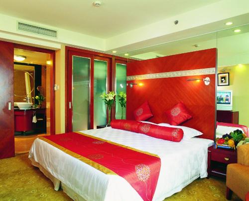 Tempat tidur dalam kamar di Tiantan Hotel