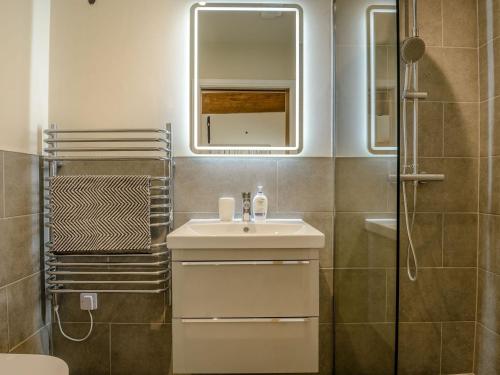 a bathroom with a sink and a shower at The Oak in Wingfield