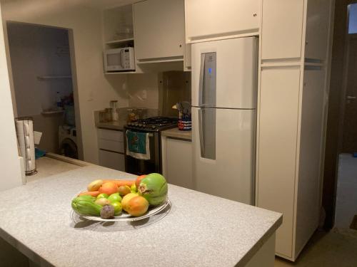 a bowl of fruit on a counter in a kitchen at Praia do Forte Iberostar in Praia do Forte