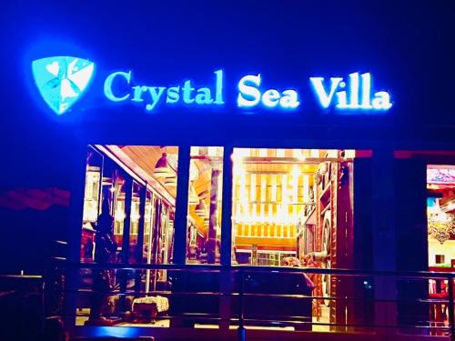 a blue sign that says cyrgiseasea villa at Crystal Sea Villa in Ko Larn