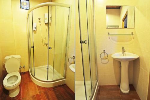 a bathroom with a shower and a toilet and a sink at Kaloang home in Bangkok