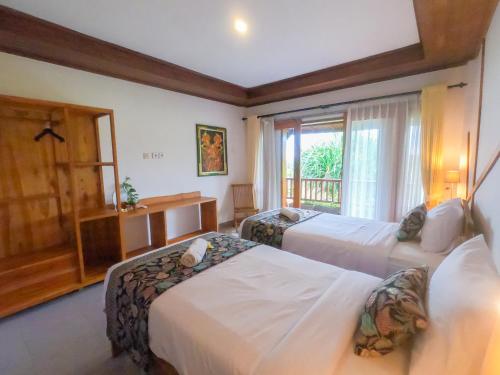 Postel nebo postele na pokoji v ubytování West Break Bali - Medewi