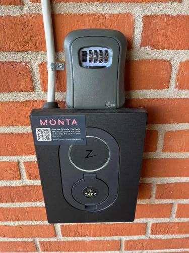 a mtnma mailbox attached to a brick wall at Casa Markskellet, Billund - hygge og leg for alle in Billund